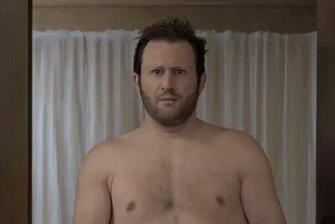 Naked man comes into room and says hello to view
